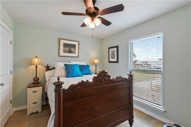 4102 Pennsylvania St, Bay Saint Louis, MS 39520 - bedroom with light wood finished floors, baseboards, and a ceiling fan