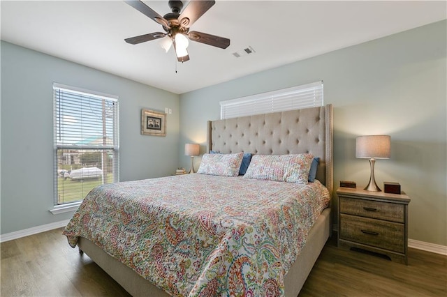 4102 Pennsylvania St, Bay Saint Louis, MS 39520 - bedroom with wood finished floors, baseboards, and ceiling fan