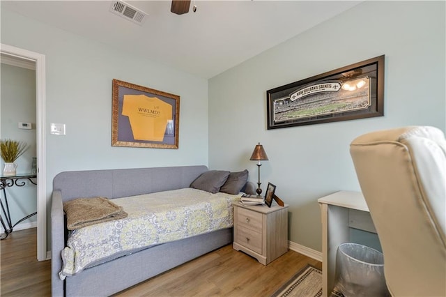 4102 Pennsylvania St, Bay Saint Louis, MS 39520 - bedroom with wood finished floors, baseboards, and a ceiling fan