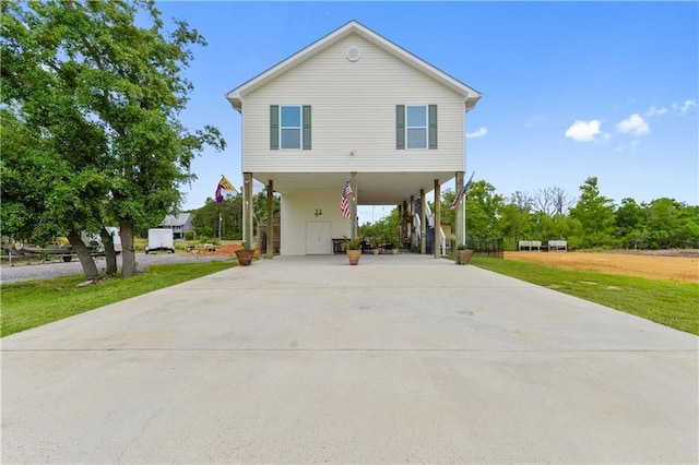 4102 Pennsylvania St, Bay Saint Louis, MS 39520 - beach home with a carport, concrete driveway, and a front yard