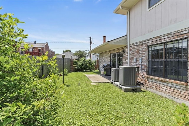 view of yard with central AC