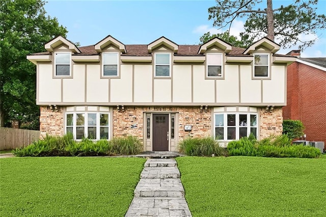 3931 S Post Oak Ave, New Orleans, LA 70131 - tudor house featuring brick siding, central AC, and a shingled roof