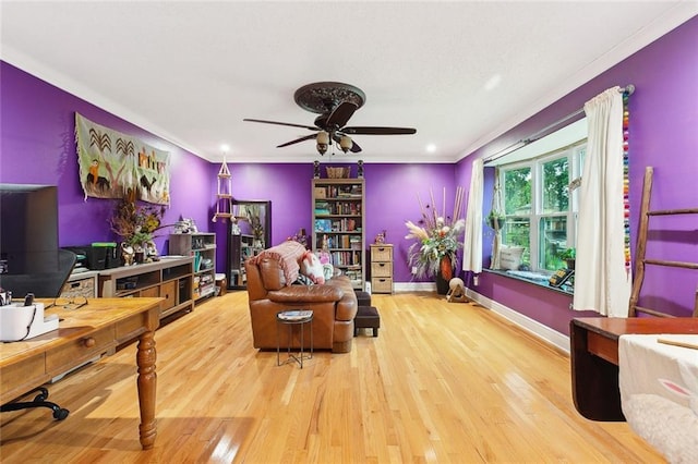 3931 S Post Oak Ave, New Orleans, LA 70131 - living room featuring wood finished floors, a ceiling fan, ornamental molding, baseboards, and a desk