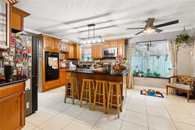 3931 S Post Oak Ave, New Orleans, LA 70131 - kitchen featuring stainless steel appliances, dark countertops, a kitchen breakfast bar, ornamental molding, and tasteful backsplash