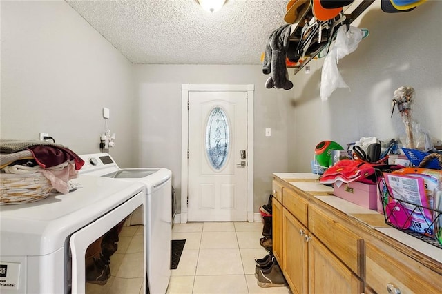 3931 S Post Oak Ave, New Orleans, LA 70131 - washroom with independent washer and dryer, cabinet space, light tile patterned flooring, and a textured ceiling