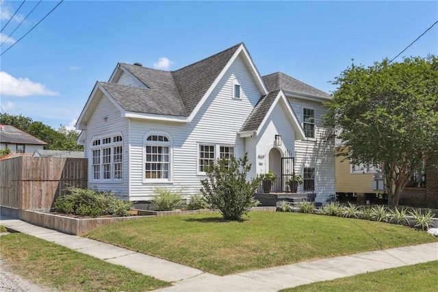 view of front of house featuring roof with shingles