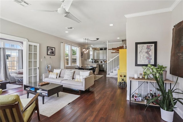 living room with a ceiling fan, dark wood-style flooring, ornamental molding, stairs, and recessed lighting