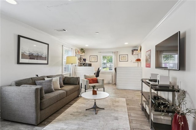 living area featuring ornamental molding, wood finished floors, and recessed lighting