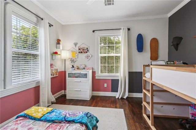 bedroom featuring wood finished floors, multiple windows, ornamental molding, and baseboards