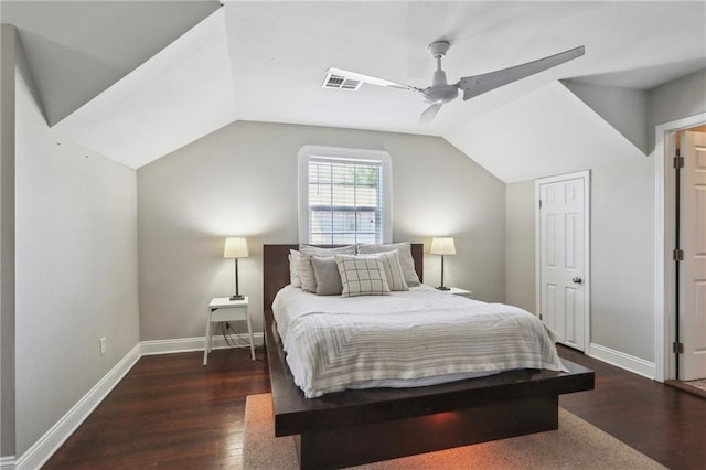 bedroom featuring dark wood-style floors, lofted ceiling, baseboards, and a ceiling fan