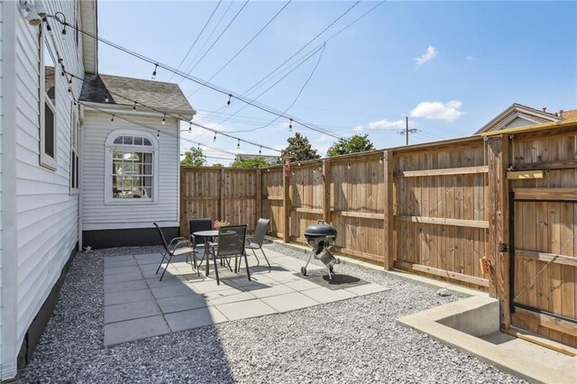 view of patio featuring fence