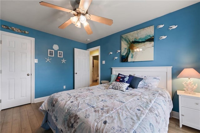 11020 Delaware St, Bay Saint Louis, MS 39520 - bedroom featuring wood finished floors, baseboards, and ceiling fan