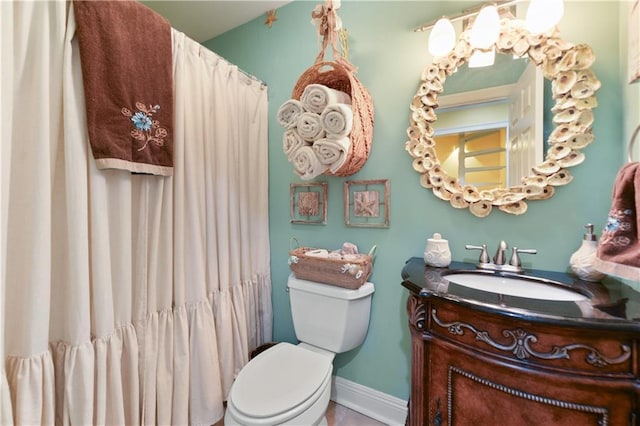 11020 Delaware St, Bay Saint Louis, MS 39520 - full bathroom with toilet, vanity, baseboards, a shower with curtain, and tile patterned floors