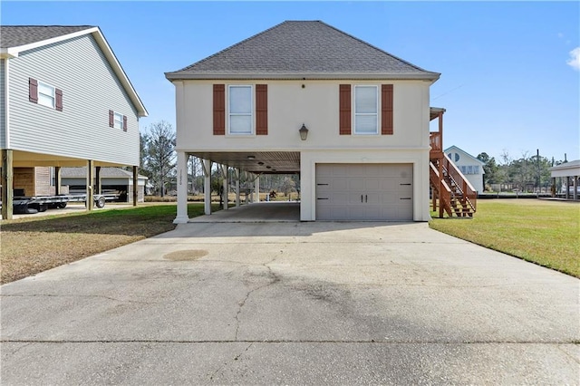 11020 Delaware St, Bay Saint Louis, MS 39520 - raised beach house featuring a carport, roof with shingles, a garage, driveway, and stairway