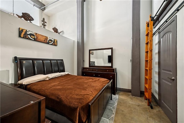 920 Poeyfarre St Unit 109, New Orleans, LA 70130 - bedroom with concrete flooring and baseboards