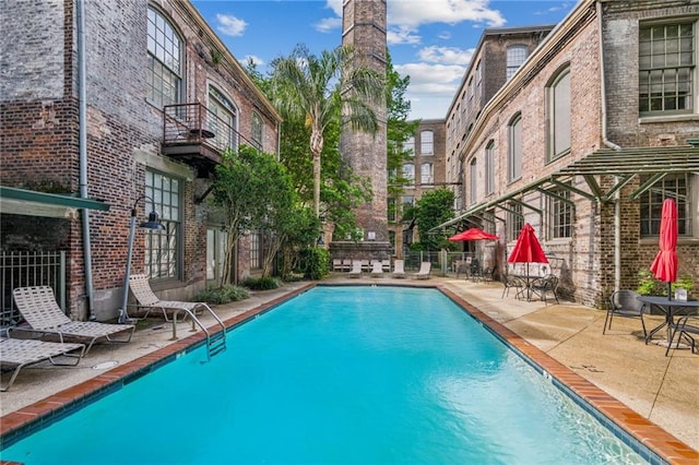 920 Poeyfarre St Unit 109, New Orleans, LA 70130 - community pool featuring fence and a patio