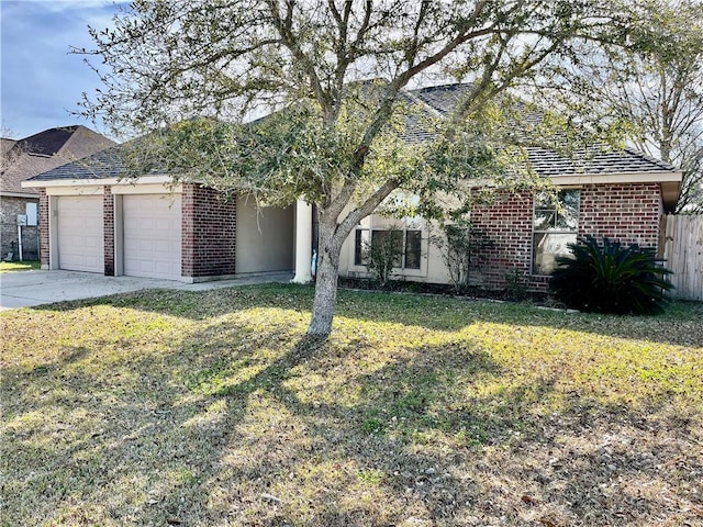 35 Derek Ln, La Place, LA 70068 - view of front of home featuring an attached garage, brick siding, and driveway