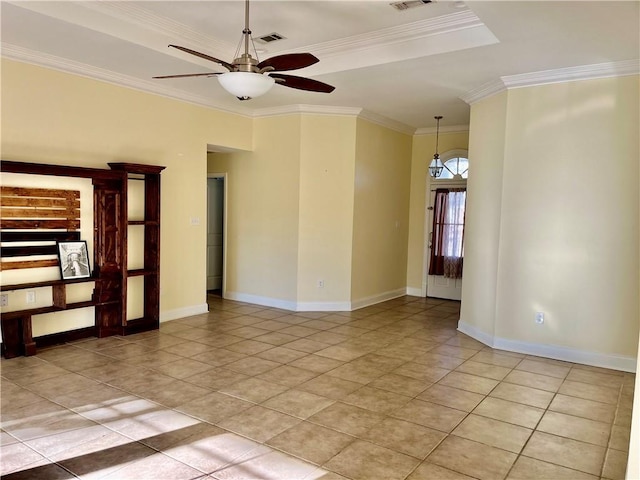 35 Derek Ln, La Place, LA 70068 - empty room with a ceiling fan, ornamental molding, light tile patterned flooring, and a tray ceiling