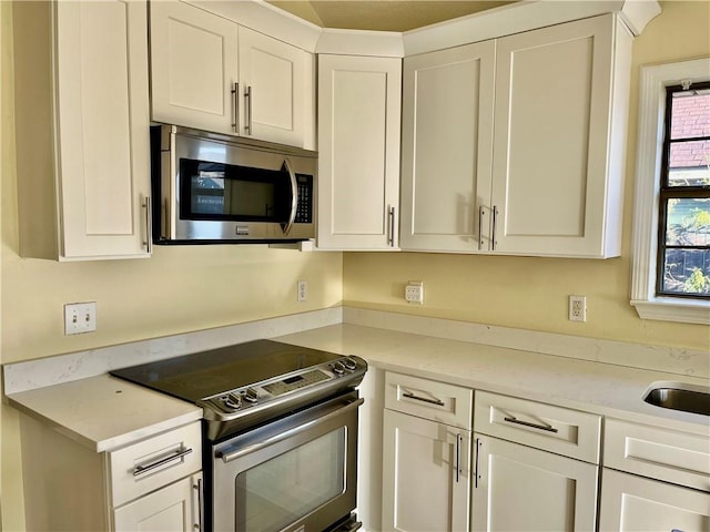 35 Derek Ln, La Place, LA 70068 - kitchen with stainless steel appliances and white cabinets