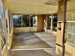 35 Derek Ln, La Place, LA 70068 - unfurnished sunroom with wooden ceiling and concrete floors