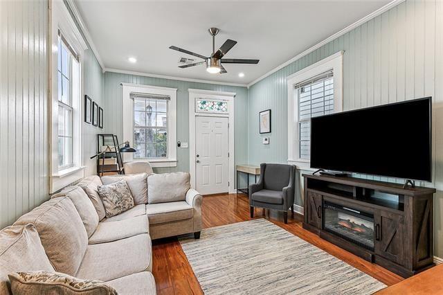 525 S Telemachus St, New Orleans, LA 70119 - living area featuring ornamental molding, ceiling fan, and wood finished floors