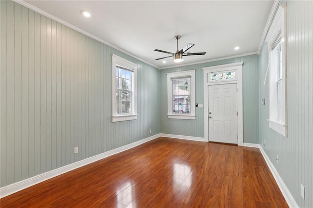 525 S Telemachus St, New Orleans, LA 70119 - foyer entrance with ornamental molding, wood finished floors, a ceiling fan, and baseboards