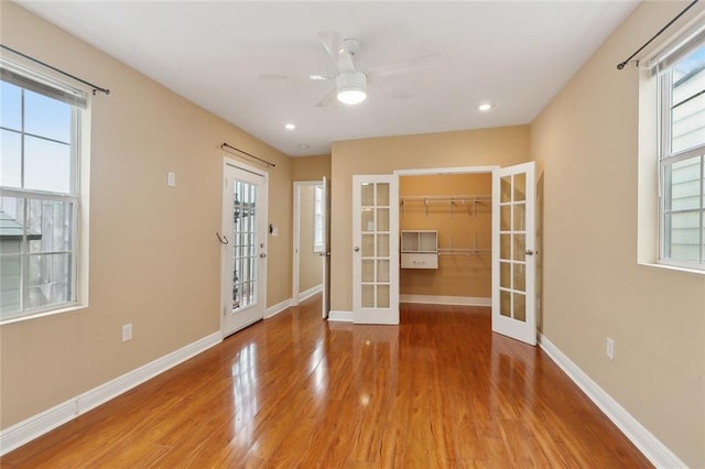 525 S Telemachus St, New Orleans, LA 70119 - unfurnished room with french doors, wood finished floors, plenty of natural light, baseboards, and recessed lighting