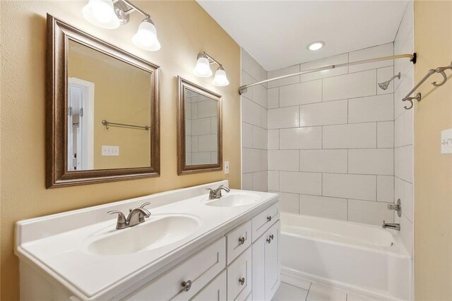 525 S Telemachus St, New Orleans, LA 70119 - bathroom featuring double vanity,  shower combination, and tile patterned flooring