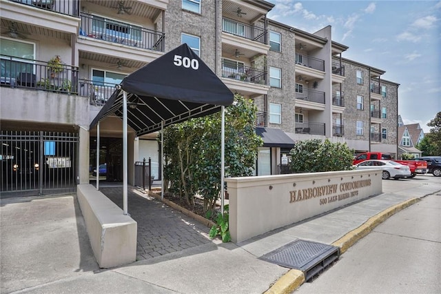 500 Lake Marina Ave Unit 408, New Orleans, LA 70124 - view of apartment building / complex with uncovered parking