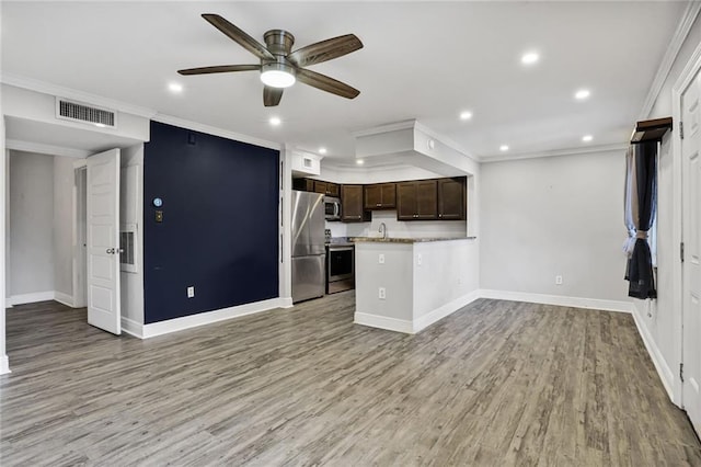 500 Lake Marina Ave Unit 408, New Orleans, LA 70124 - kitchen with stainless steel appliances, open floor plan, light countertops, a ceiling fan, and dark brown cabinetry