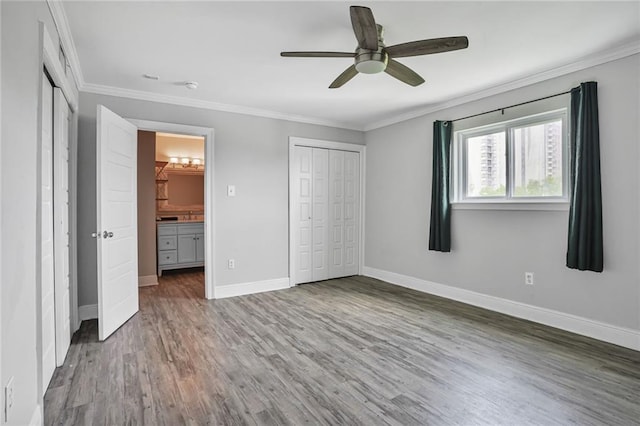 500 Lake Marina Ave Unit 408, New Orleans, LA 70124 - unfurnished bedroom with wood finished floors, crown molding, and ceiling fan