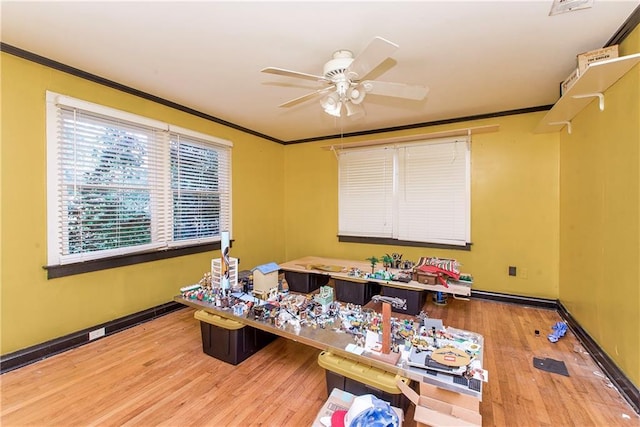 710 W Michigan St, Hammond, LA 70401 - home office featuring ceiling fan, crown molding, wood finished floors, and baseboards