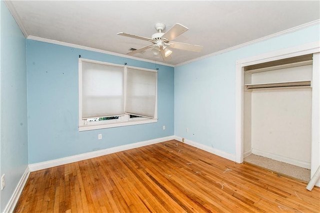710 W Michigan St, Hammond, LA 70401 - unfurnished bedroom with hardwood / wood-style flooring, a closet, ornamental molding, and baseboards