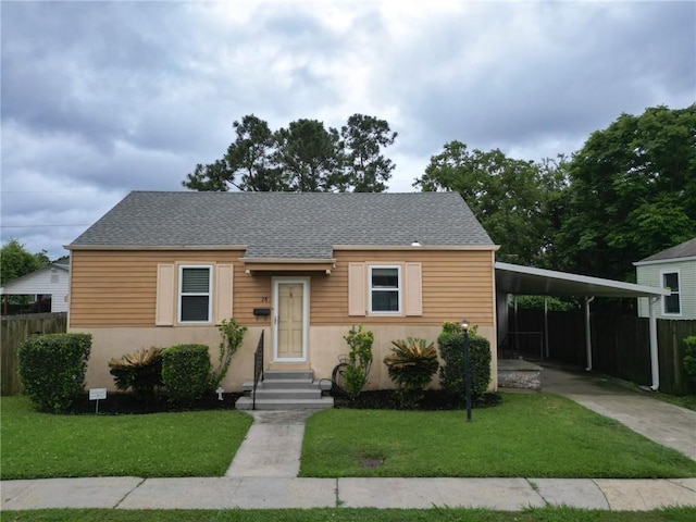 28 San Jose Ave, Jefferson, LA 70121 - view of front facade featuring driveway, an attached carport, roof with shingles, and stucco siding