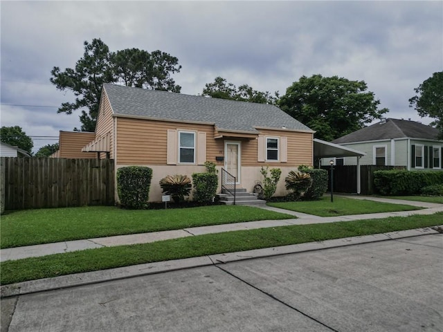 28 San Jose Ave, Jefferson, LA 70121 - bungalow-style house with concrete driveway, a carport, roof with shingles, and stucco siding