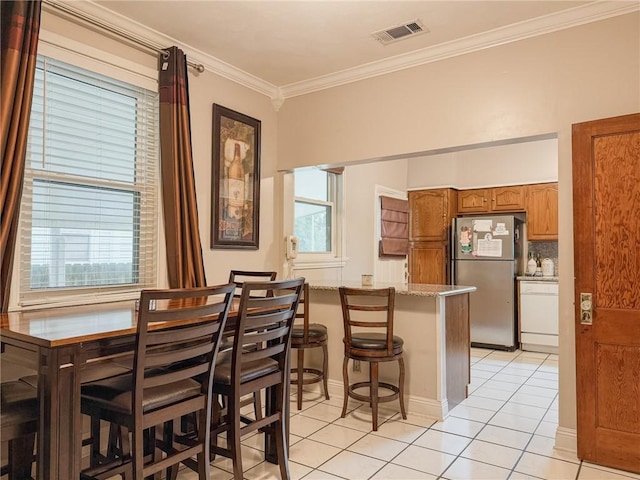 28 San Jose Ave, Jefferson, LA 70121 - dining space with light tile patterned floors and crown molding