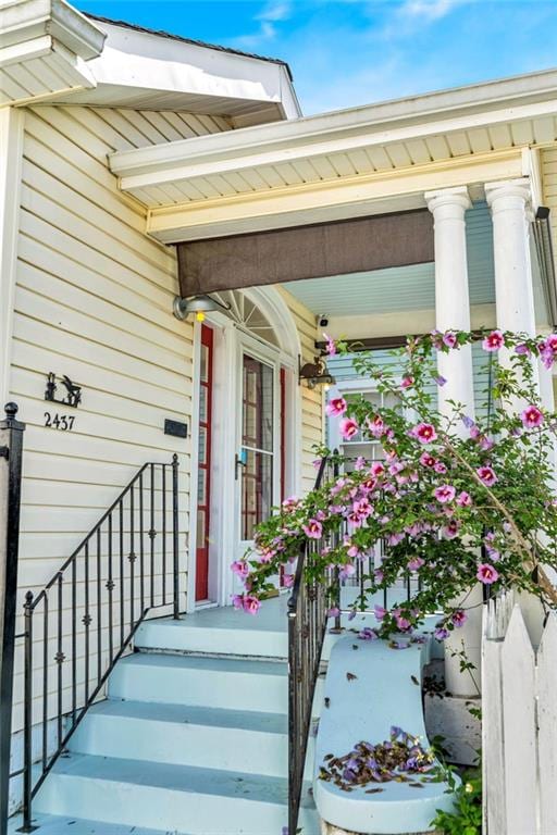 2437 Jonquil St, New Orleans, LA 70122 - doorway to property featuring a porch