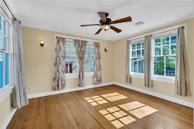 2437 Jonquil St, New Orleans, LA 70122 - spare room with baseboards, wood finished floors, and ceiling fan