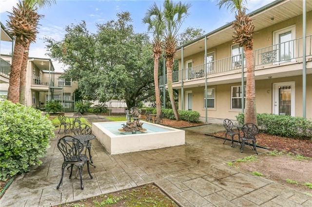 view of community with a patio