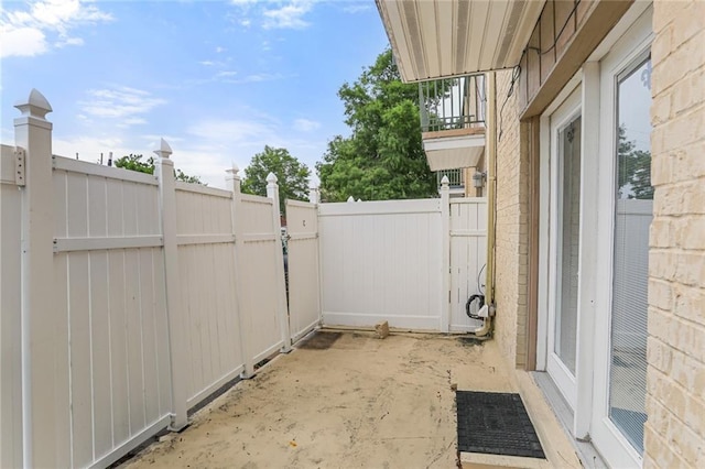 view of patio / terrace with fence and a gate