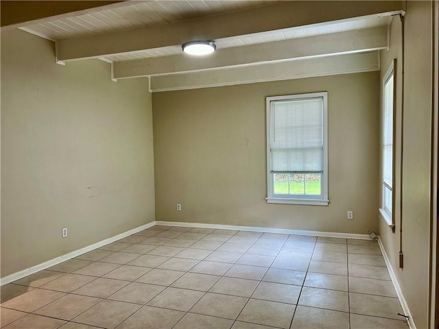 204 W 11th Ave Unit 4, Covington, LA 70433 - spare room featuring light tile patterned floors, beam ceiling, and baseboards
