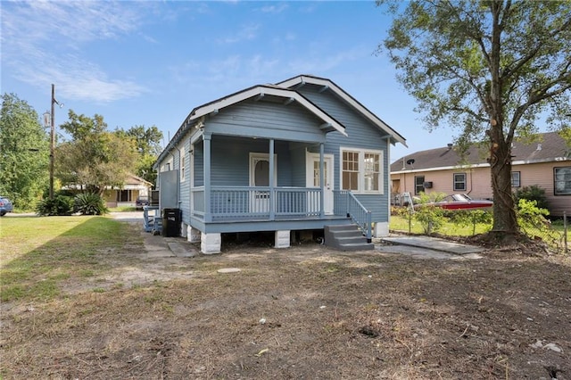 1225 S Genois St, New Orleans, LA 70125 - view of front of home featuring covered porch