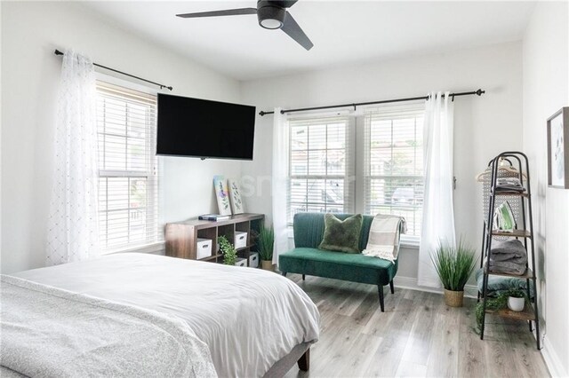 2522 Robert St, New Orleans, LA 70115 - bedroom with wood finished floors, baseboards, and ceiling fan