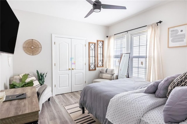 2522 Robert St, New Orleans, LA 70115 - bedroom with a closet, light wood finished floors, and ceiling fan