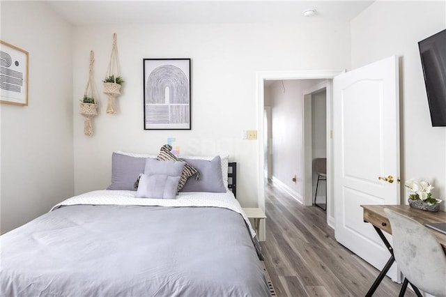 2522 Robert St, New Orleans, LA 70115 - bedroom featuring wood finished floors and baseboards