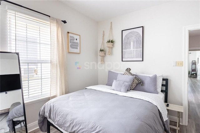 2522 Robert St, New Orleans, LA 70115 - bedroom featuring wood finished floors and baseboards