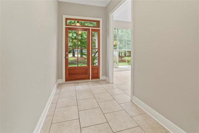 213 Secluded Oaks Ln, Madisonville, LA 70447 - doorway to outside featuring light tile patterned floors and baseboards