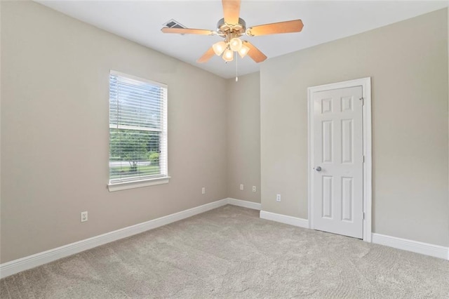 213 Secluded Oaks Ln, Madisonville, LA 70447 - empty room with carpet, a ceiling fan, and baseboards
