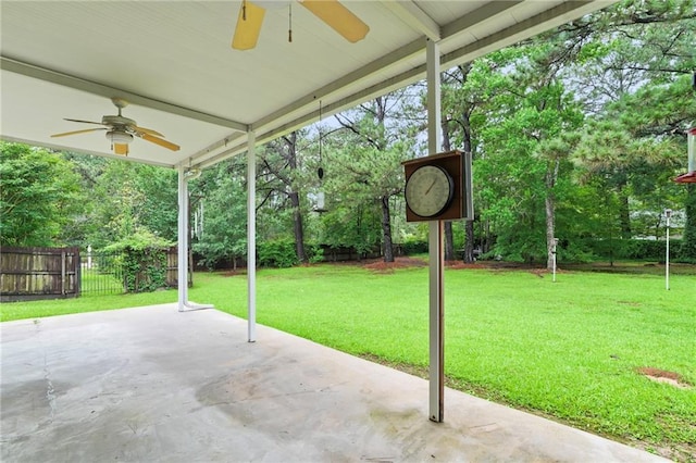 213 Secluded Oaks Ln, Madisonville, LA 70447 - view of patio / terrace with a ceiling fan and view of wooded area
