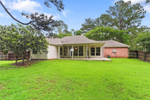 213 Secluded Oaks Ln, Madisonville, LA 70447 - back of property with a patio area, brick siding, and roof with shingles
